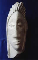 Sculpture of a warrior's head carved in soapstone entitled 'Warrior'